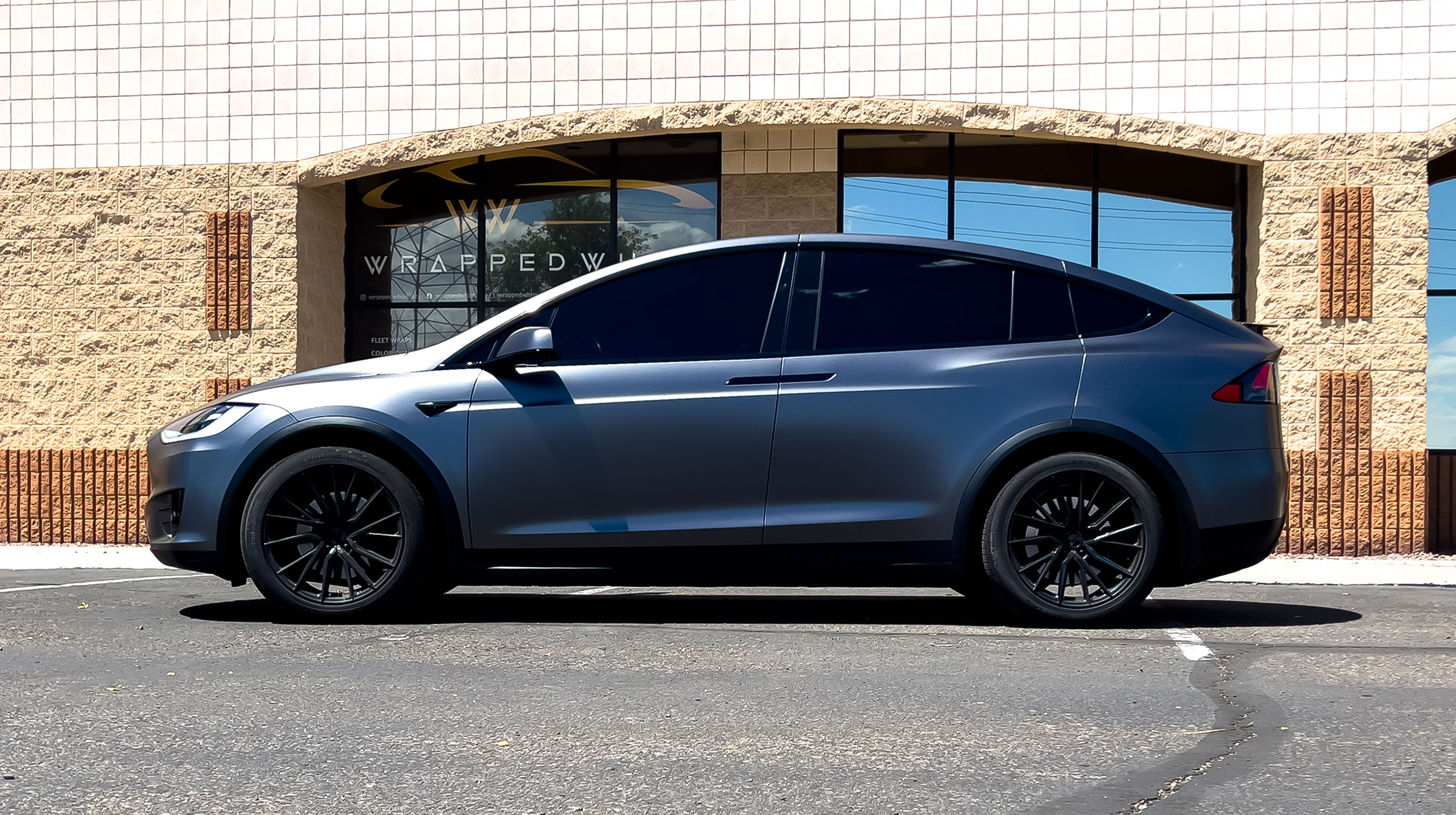 Tesla Model X with ceramic coating applied over a vinyl wrap